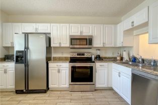Low Rise (1-3), 7794 Emerald Cir # 102, Naples FL 34109